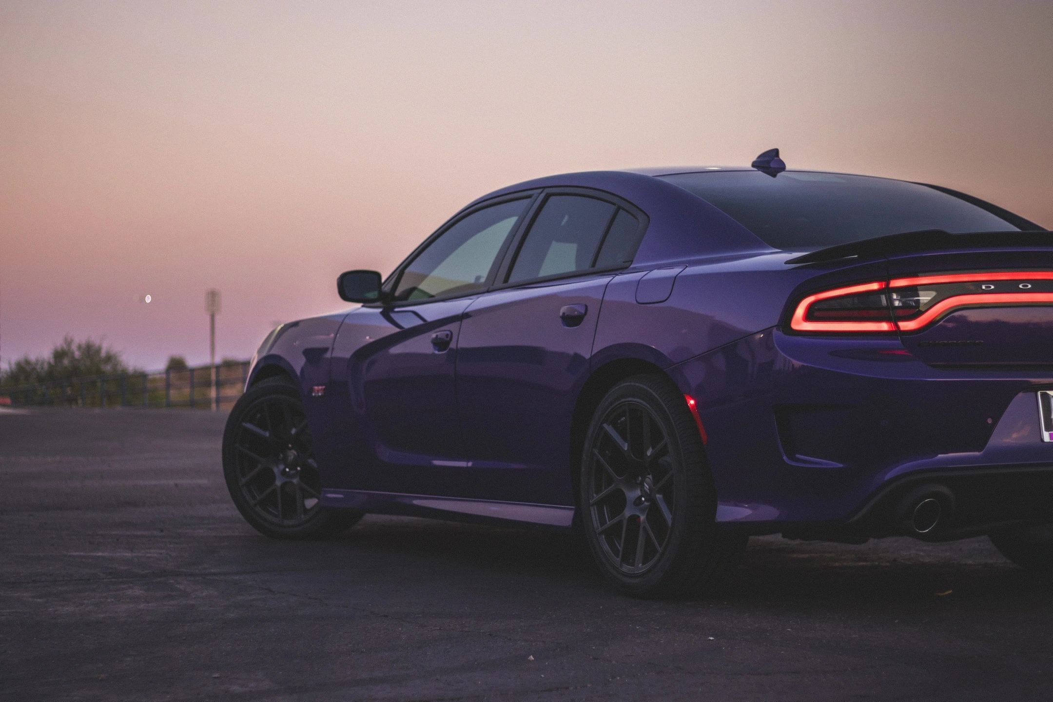Purple Dodge Charger at sunset.